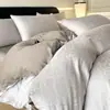 Conjunto de cama de quatro peças de cetim jacquard de algodão de fibra longa Classe A, algodão de três peças, luxo leve, alta qualidade, capa de edredom de cor sólida