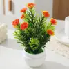 Planta artificial em vaso com flor de ameixeira de cinco folhas para decoração de mesa de jantar em ambientes internos. Ideal para decoração de interiores.