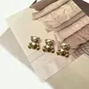 Oso de dibujos animados lindo dorado claro pierna alta botón de metal abrigo de tweed cárdigan suéter top hebilla decorativa