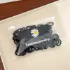 100 Piezas Gomas para el Cabello de Margarita Sencillas Empaquetadas en Bolsa Bandas de Goma de Nylon Coloridas Anillos de Toalla Accesorios de Cabello de Moda Cuerdas para el Cabello Lote