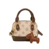 Bolso de Mano Mini de Diseño de Nicho Vintage de Moda 2026 Primavera Nuevo Bolso de Concha Cruzado para Mujer Cartera para Labiales y Monedas