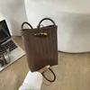 Bolsa de palha tecida exclusiva para mulheres, novo modelo 2026, bolsa versátil de ombro e transversal, mini bolsa de celular requintada, bolsa de mão pequena