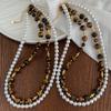 Guofeng Vintage Maillard alta calidad Ojo de Tigre Natural de alto brillo Perla Australiana Blanca Artificial Cadena Doble para Clavícula