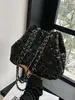 Bolso de diseñador de nicho transfronterizo para mujer, nuevo modelo 2026, bolso de hombro cruzado de cadena de alta gama, bolso tipo cubo con lentejuelas estilo coreano