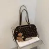 Bolso coreano de nuevo estilo Otoño 2026 Alta apariencia Personalidad Lunares Elegante Bolso de axila Moda Viaje Diario Bolso de un solo hombro