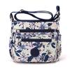 Bolsa Feminina 2026 Novo Estilo Bolsa de Ombro de Nylon Estampada Bolsa Transversal de Lona Bolsa para Mãe de Meia-Idade Mochila Casual da Moda Feminina