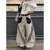 Pantalones casuales de pierna ancha con estampado de leopardo y patchwork estilo callejero americano para mujer, holgados y adelgazantes con diseño de tres rayas y un corte curvo único
