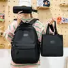 Mochila casual de color sólido simple multicapa de comercio exterior nuevo conjunto de tres piezas para estudiantes de primaria y secundaria
