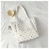 Bolso tote de lunares con un solo hombro de diseño único para mujer, nuevo modelo de verano 2026, gran capacidad, bolso con cremallera para el trabajo