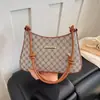Bolso de hombro de moda retro minimalista, diseño de nicho, bolso casual nuevo, bolso de axila para mujer tendencia verano 2026