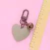 Nuevo llavero Bell love colgante lindo color resina corazón de durazno accesorios pequeño fresco adornos de corazón de durazno