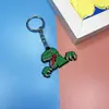 Novo Pingente de Chaveiro de Boneco Dinossauro de Desenho Animado para Carro Bolsa Celular Pingente de Borracha Macia PVC Presente
