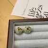 Novedad 2024 Pendientes Elegantes de Lujo Ligero Diseño de Nicho Pendientes de Gama Alta Gotas de Esmalte Nudo Conforme Bolas Redondas Pendientes para Mujer