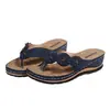 Sandalias de cuña para mujer transfronterizas 2026 verano nuevas chanclas florales estilo europeo y americano suela gruesa talla grande chanclas de playa