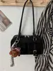 Bolso de mujer único de nicho estilo coreano, nuevo modelo primavera 2026, exquisito y elegante, bolso de hombro y bandolera simple y casual