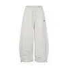 Pantalones de chándal anchos color blanco roto con raya lateral Bordado de logotipo pequeño Cintura con cordón Holgados Se pueden remangar Casual Deportivos Pantalones largos