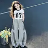 Conjunto de Verão para Meninas 2026 Novo Estilo para Crianças Maiores, Calça Esportiva Solta, Conjunto de Duas Peças com Calça de Perna Larga Curva de Manga Curta Tendência