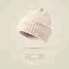 Bestseller transfronterizo de invierno: gorro tejido grueso con forro de polar y pompón, gorro clásico de punto trenzado versátil, gorro de lana de color liso a la moda