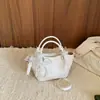Bolsas populares deste ano bolsas femininas 2026 Primavera/Verão nova tendência elegante temperamento bolsa de ombro quadrada pequena bolsa tiracolo de celebridade da internet