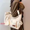 Bolsa tote de lona para estudantes universitárias, versátil e de grande capacidade, adequada para o trajeto e para carregar livros para a aula, com zíper