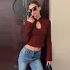 Ropa de mujer transfronteriza 2026 otoño nueva moda ajuste ceñido manga larga adelgazante top sexy camiseta de encaje hueco venta al por mayor