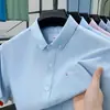 Camisa Oxford 100% Algodão 2026 Nova Moda Camisa Casual Simples e Confortável Cardigã Masculino de Manga Curta