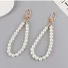 Llavero directo de fábrica hebilla de puerta colgante para teléfono móvil diy perla de imitación bolsa pequeña corta cartera muñeca cadena de mano venta al por mayor