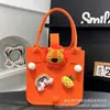 Bolsa de Fieltro de Muñeca Pequeña de Dibujos Animados Bolsa de Compras Linda Mano de Niño Caja de Regalo Banquete de Cien Días del Bebé Bolso de Mano de Fieltro