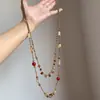 Colar de borla com contas florais azuis de alta qualidade para mulheres, um choker único para usar em camadas, corrente de clavícula chique e versátil