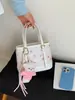 Bolso Pequeño Versátil de Primavera para Mujer 2026 Nuevo Estilo Dulce y Femenino Bolso Cubo Estampado Bolso Cruzado de Gama Alta