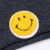 Gorro transfronterizo para mujer otoño e invierno etiqueta de cara sonriente gorro de punto para pareja moda grueso invierno jersey gorro de lana estudiante