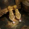 Pendientes vintage de flores huecas de estilo cortesano antiguo medio, pendientes distintivos de moda, pendientes de lujo ligeros que combinan con todo, pendientes de alta gama.