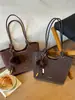 Bolso de hombro casual y minimalista con textura de estampado de leopardo para mujer, nueva colección otoño/invierno 2026, moderno y versátil para ir al trabajo, un bolso tote que se puede llevar en la mano