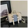Nueva bolsa de viaje de moda de comercio exterior, gran capacidad, diseño moderno y minimalista, adecuada para viajes cortos, viajes de negocios y uso en el gimnasio, se puede llevar en la mano o usar como bolsa cruzada
