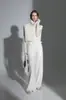 Chaleco de punto suelto adelgazante con cuello alto apilado estilo francés y pantalones rectos de pierna ancha para otoño-invierno, modelo nuevo de nicho 2026