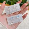 Pendientes Inteligentes Rosa Azul Mariposa Ojo de Gato Aguja de Plata para Mujer Nicho Único Lujo Ligero Asimétrico Borla Diseño con Sentido Pendientes
