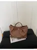 Bolso de cubo tejido de nicho transfronterizo 2026 nuevo bolso de cesta de moda para mujer bolso de mano simple para hombro cruzado
