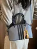 Yozzi 2026 principios de otoño nueva moda de moda bolso de hombro cruzado de gran capacidad, elegante bolso de mano tipo cubo para el trabajo
