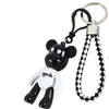 Corda de Couro Trançada Criativa Pingente de Urso Violento Chaveiro de Urso Fofo Bolsa Pequeno Presente Boneco de Máquina de Gashapon Boneco Venda por Atacado