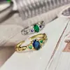 Anillo de esmeralda imitación Versa para TikTok en el extranjero, diseño de nicho femenino, cristal verde puntiagudo, anillo abierto de moda de lujo ligero