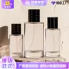 Ventas Directas de Fábrica En Stock Cilíndrica Modelo Nuevo 30ml 50ml Tapa de Presión Botella Vacía de Vidrio para Perfume Botella de Vidrio Rellenable