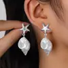Novedades de Verano Moda Transfronteriza Europea y Americana Estilo Vacaciones en la Playa Aleación Estrella de Mar Perla de Imitación Concha Pendientes para Mujer Venta al por Mayor