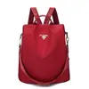 Comércio exterior mochila moda quente feminina 2024 moda coreana versátil tecido Oxford mochila antifurto bolsa feminina com pingente