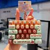 Juguetes creativos de moda al por mayor, llaveros de teclado mecánico de 26 teclas para aliviar el estrés, accesorios para niños y estudiantes