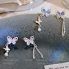 Aretes Asimétricos de Mariposa con Borla y Piedra Ojo de Gato para Mujer, Estilo Súper Hada, Diseño Único y Elegante, Aretes Impresionantes