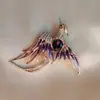 Broche Sentido Avanzado Nicho Lujo Ligero Incrustado de Diamantes Fénix Alas Elegantes Pin para Ropa Corsage para Abrigo Accesorios Venta al por Mayor