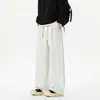 Calça de design moderno com blocos de cor e barra curva para homens, estilo americano outonal, calça larga casual solta, calça reta versátil de alta rua