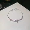 Pulsera con colgante de lazo de circonita, versátil para el uso diario, diseño para ir al trabajo, sensación de lujo ligero y alta gama, joyería para mujer al por mayor