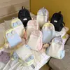 Nova mochila color block para estudantes com orelhas de coelho fofas, mochila escolar de alta aparência de desenho animado para meninas, mochila leve transfronteiriça para atividades ao ar livre