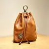 Bolsa para monedas de piel de vaca de capa superior, tarjetero vintage de cuero genuino, bolso pequeño colgante, bolsa con cordón multifuncional transfronteriza